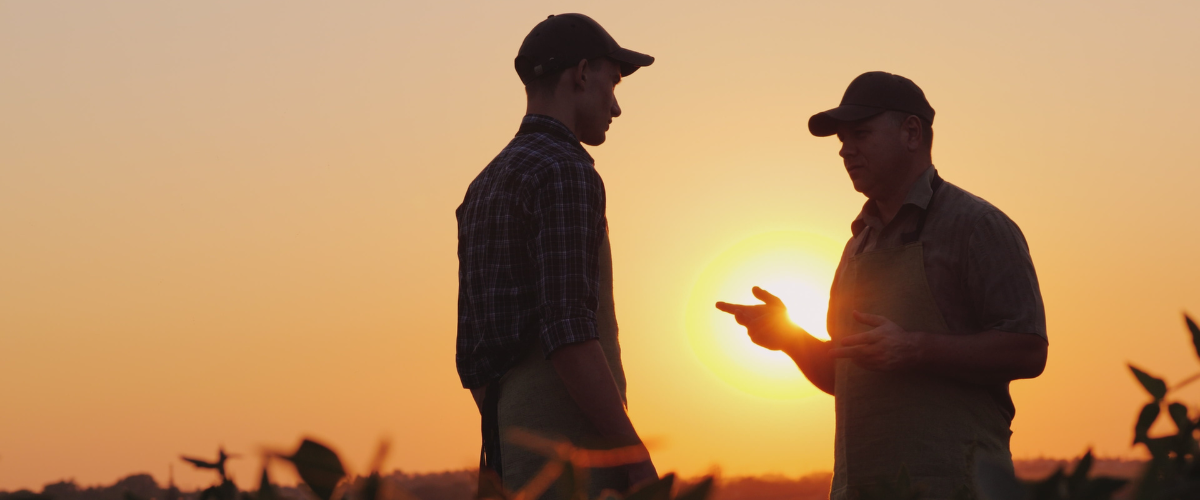 a farmer and banker speaking image of a farmer and banker speaking.