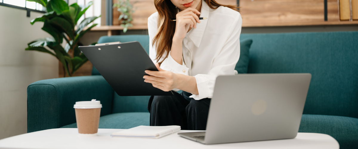 Image of A woman entrepreneur reviewing a profit and loss statement