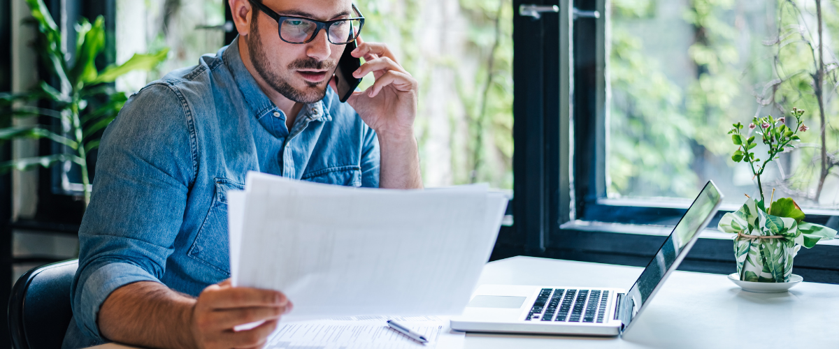 A small business owner using bank wire best practices to protect their business finances from wire transfer fraud