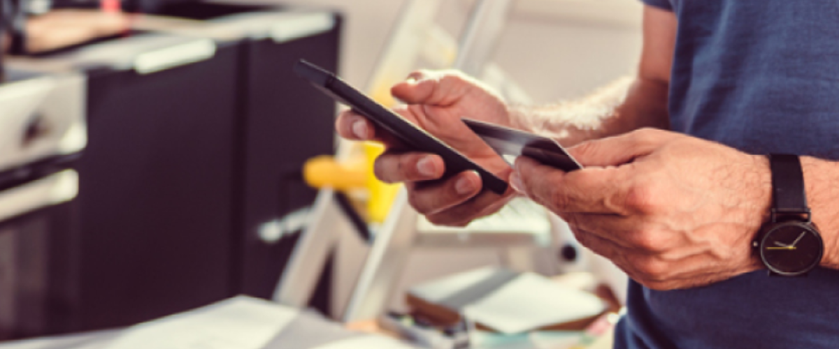 Close-up of a premium business credit card being used by a business Image of an owner to access small business funding options and manage revolving business credit.