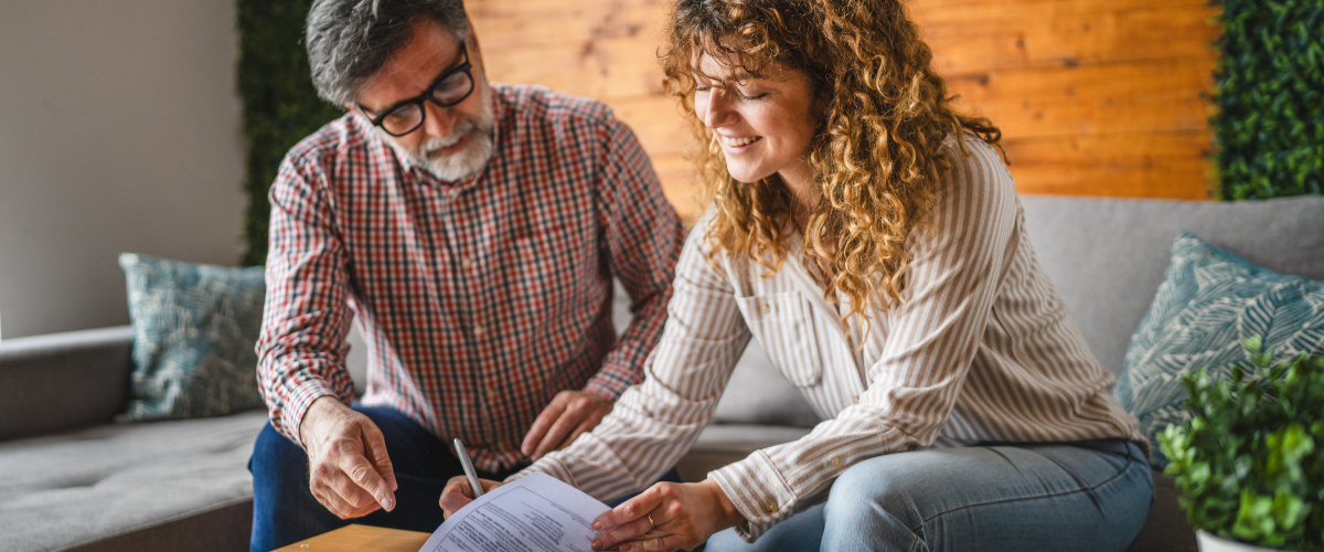 Image of A person reviewing estate planning documents with a financial advisor