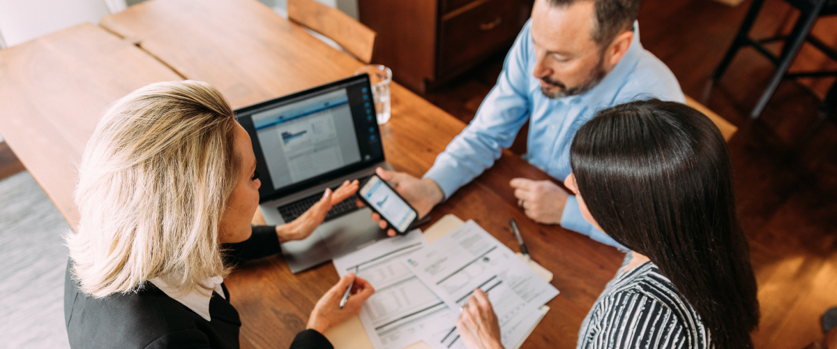 Image Of A Financial Advisor Working With Clients