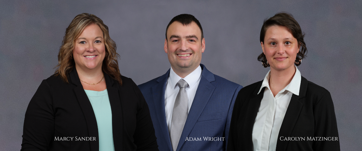 Image of intro to commercial lending school attendees Marcy Sander, Adam Wright, and Carolyn Matzinger