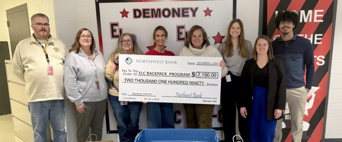 ELC Second Grade teachers accept donations presented by Northwest Bank President, Marcy Sander, and Customer Service Representatives.