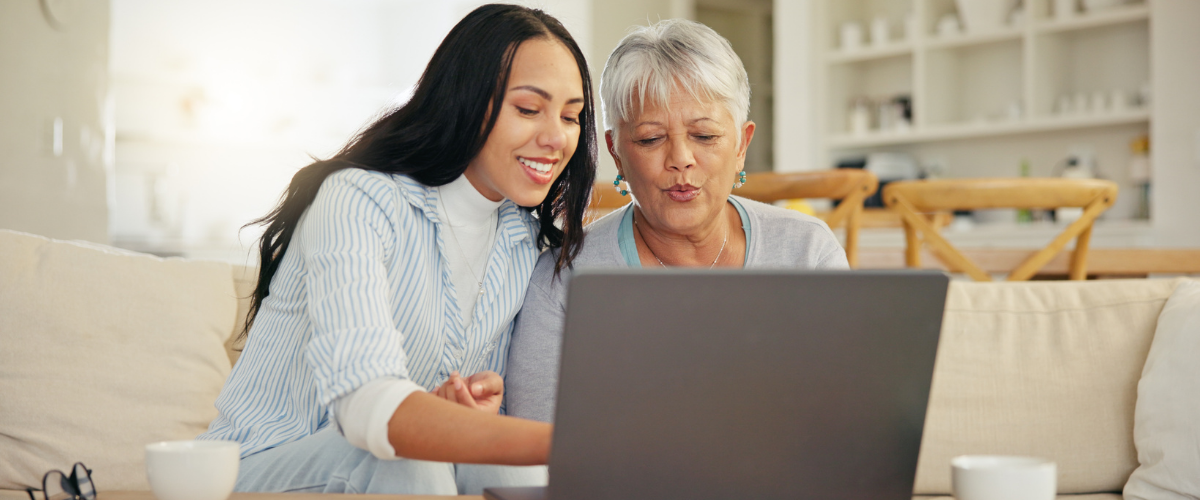 Image of an older adult reviewing information on a laptop or tablet