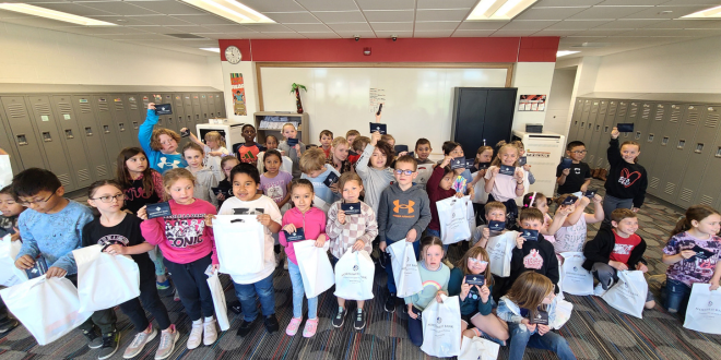Image Of Kids Participating In Northwest Bank's Teach Children To Save Lesson