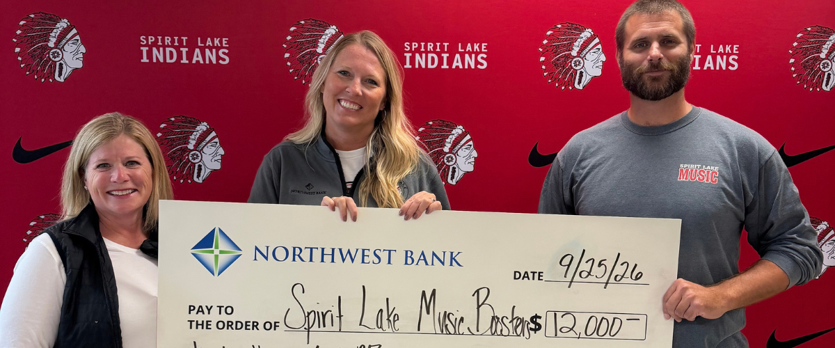 Nicole Evans, Northwest Bank Lakes Market President presented the donation to Cindy Mouw, Spirit Lake Music Boosters President and Tyler Pedersen, Spirit Lake High School band director