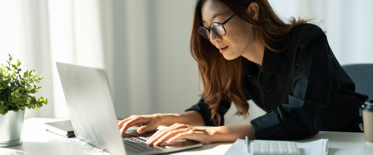A woman small business owner navigating quarterly and annual small business taxes