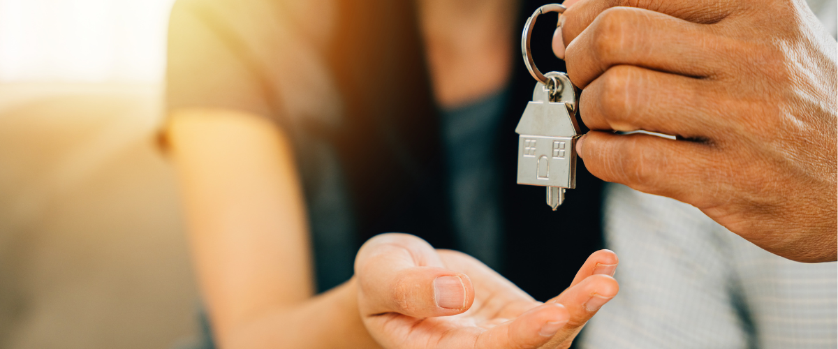 Image Of Home Owner Purchasing Their First Home