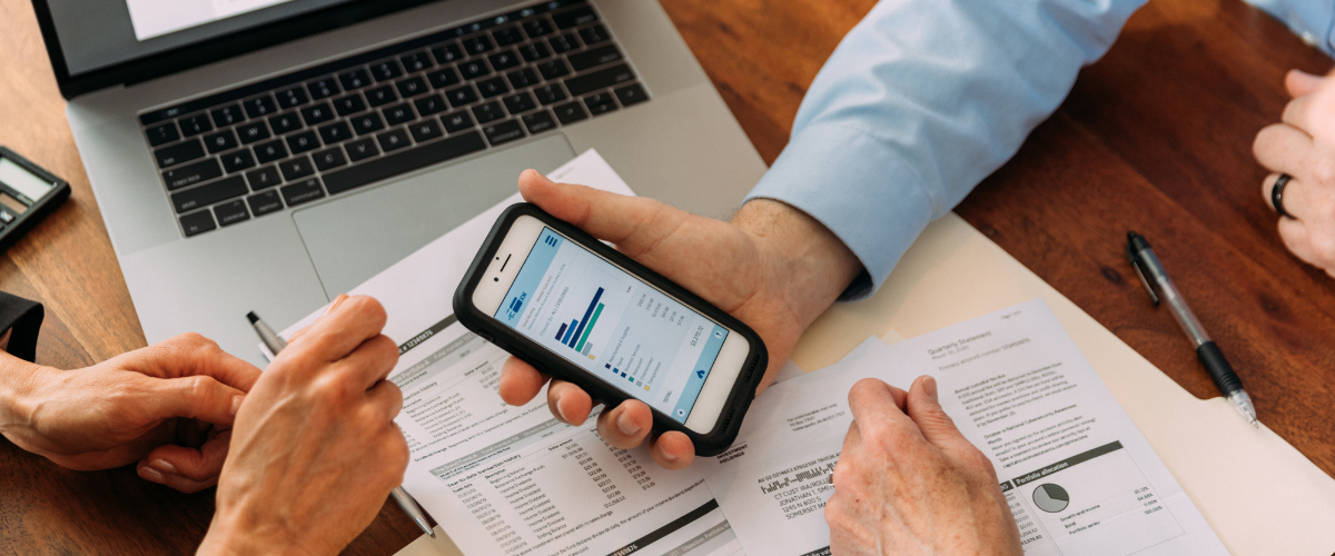 A small business owner following financial planning milestones for startup success
