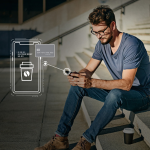 Man Receiving Card Secure Alerts On His Phone About His Debit Card