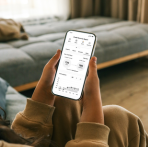 A person holds a smartphone displaying a Credit Sense dashboard with credit score information, score tracking tools, and credit insights. Credit Sense helps users monitor their credit, track progress toward goals, and stay informed year-round.