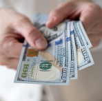 Image of Someone Holding Money After Choosing Winning Moves with Northwest Bank