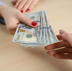 Image of Someone Holding Money After Choosing Winning Moves with Northwest Bank