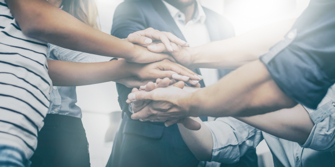 Image Of A Collaborative Group Of Indviduals Working Together