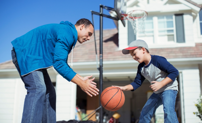 Image of a Dad & Son playing basketball