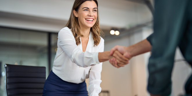 Woman Shaking Hands With Their Private Banking Client