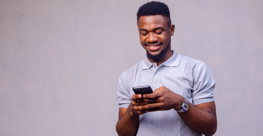 Man Using Phone Looking at CD Specials