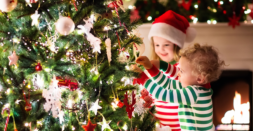 Kids decorating a Christmas Tree 