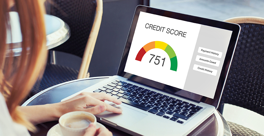 image of laptop with credit score rating displayed