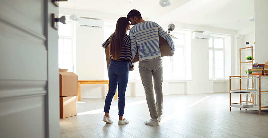 image of couple moving into house