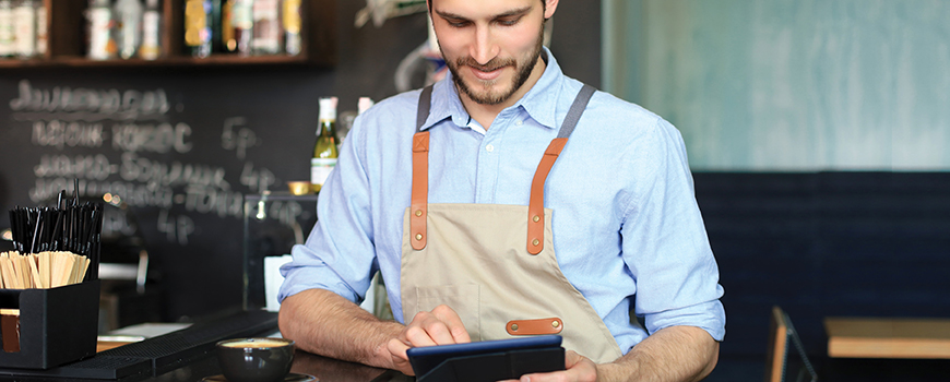 image of business owner looking at tablet