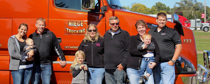 image of Niece Trucking family in front of truck. 